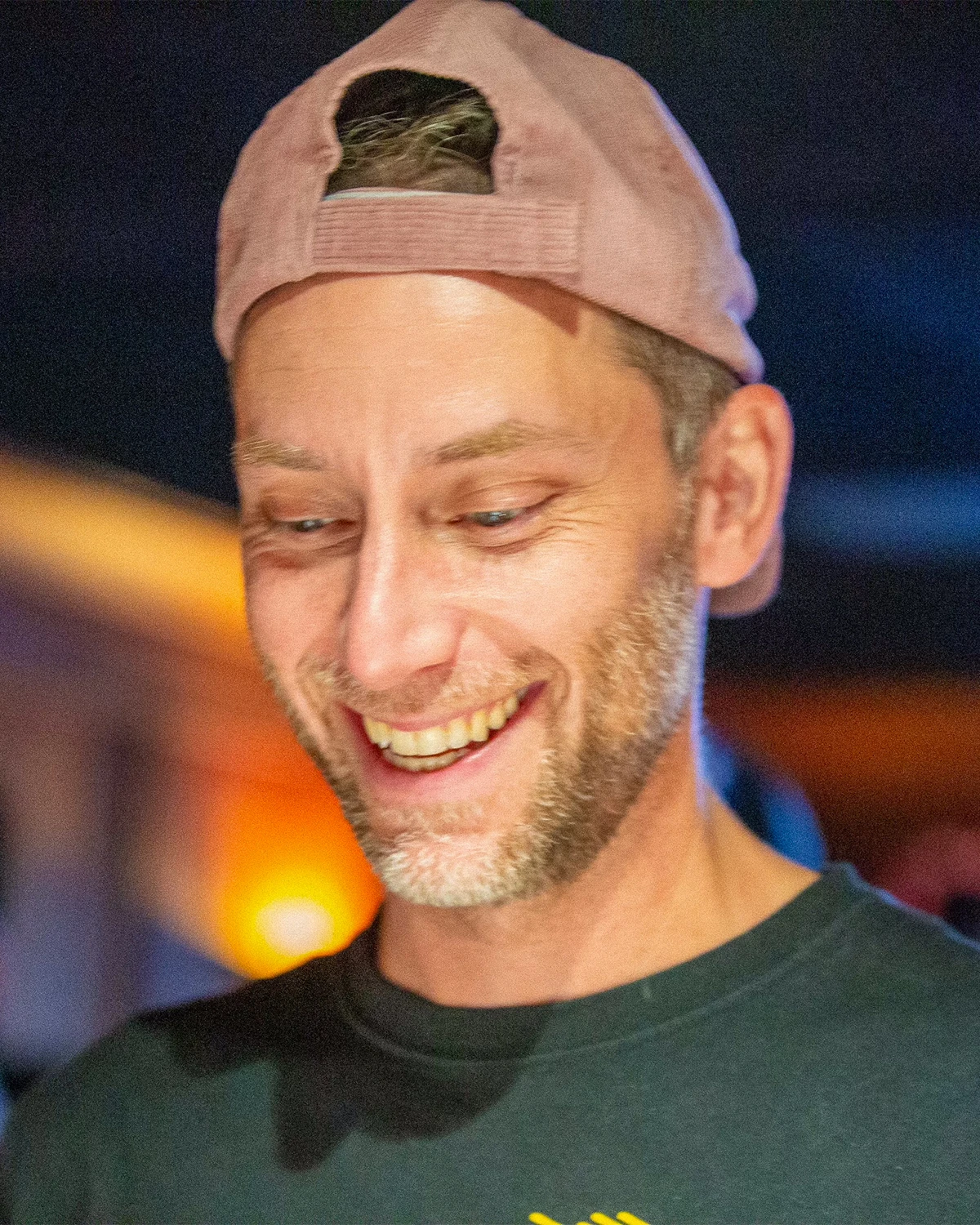 Matt Whitfield smiling on the set of Resting Pitch Face, a dark comedy short film.